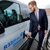 civilian filling up a low-carbon vehicle with new "Blue Gasoline"