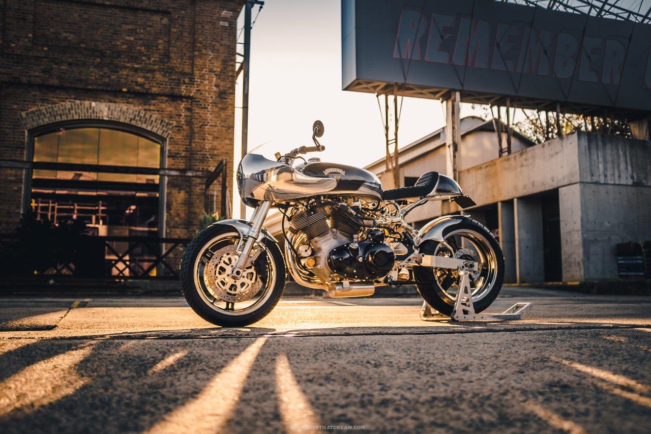 A restomod Vincent Black Shadow racer at sunset in an industrial area in Sydney