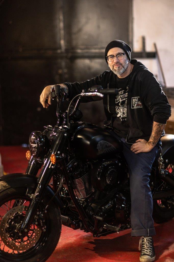 Ola Stenegard, Design Director for Indian Motorcycles sits on a new Chief model