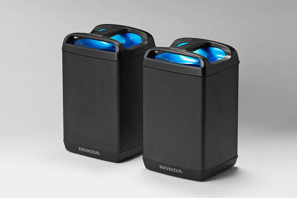 Universal batteries could look like these units, displayed by Honda at the 2017 Tokyo Motor Show with a concept PCX electric scooter.