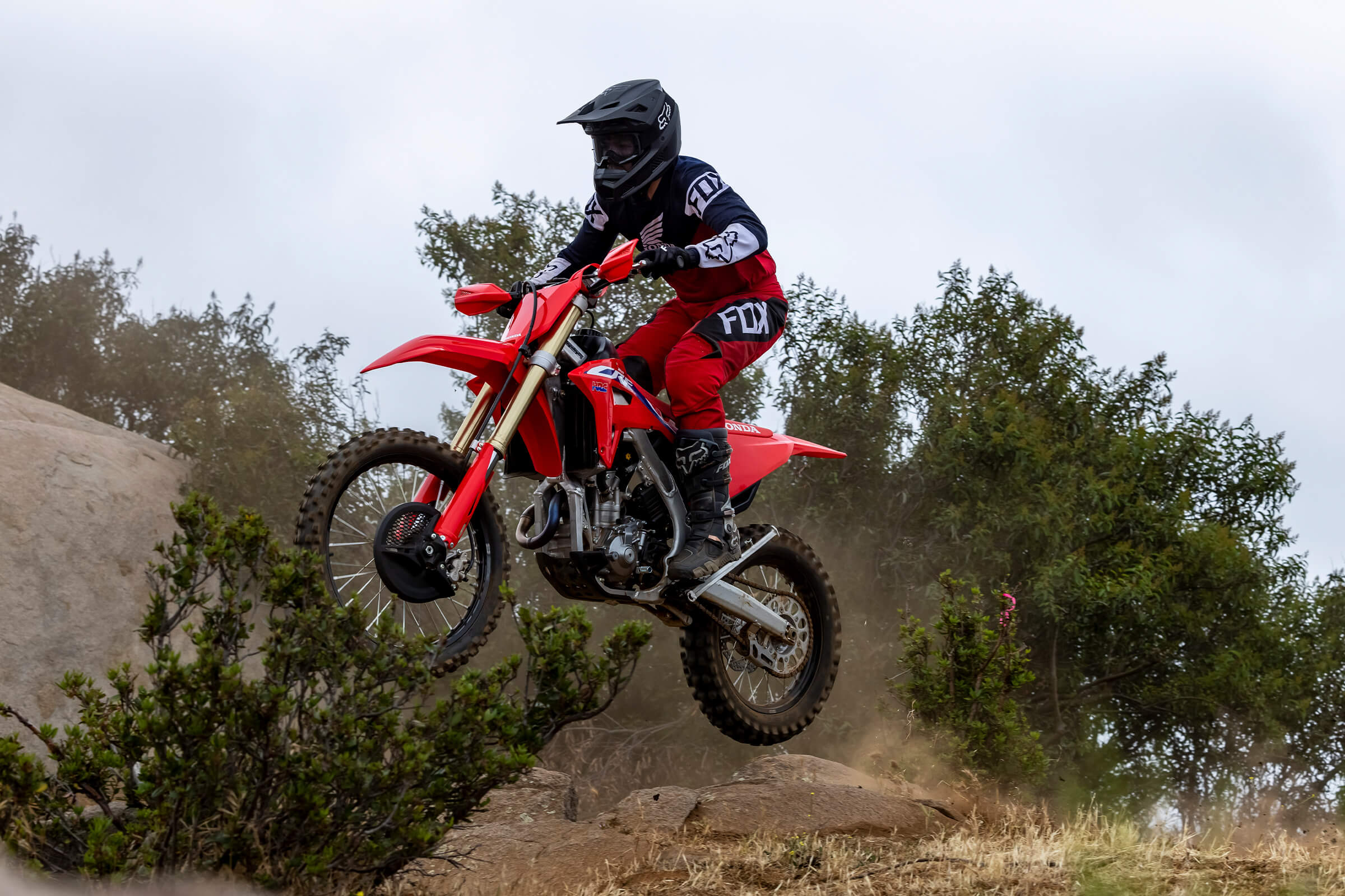 a side view of a rider enjoying the new 2022 Honda CRF250RX