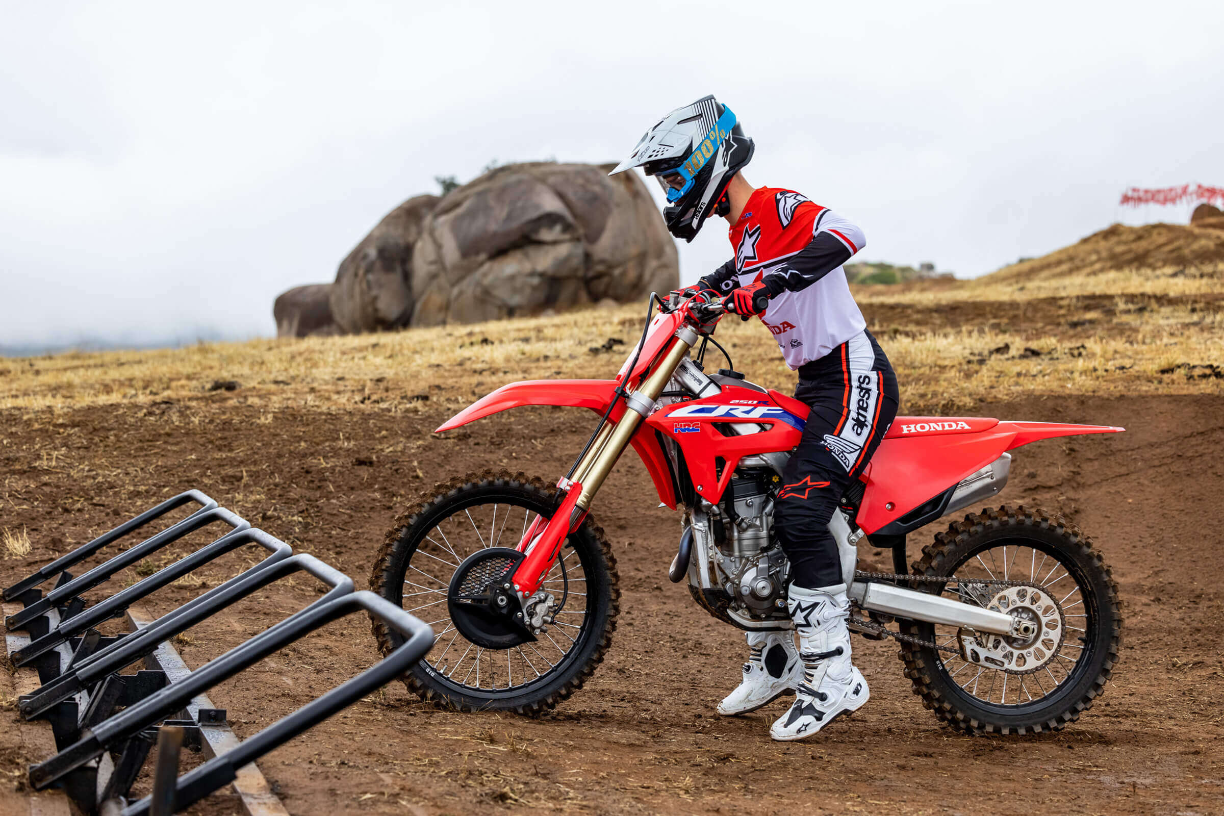 a side view of a rider on the Honda CRF250R