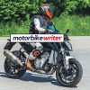 a front right view of spy shots taken of a new KTM machine