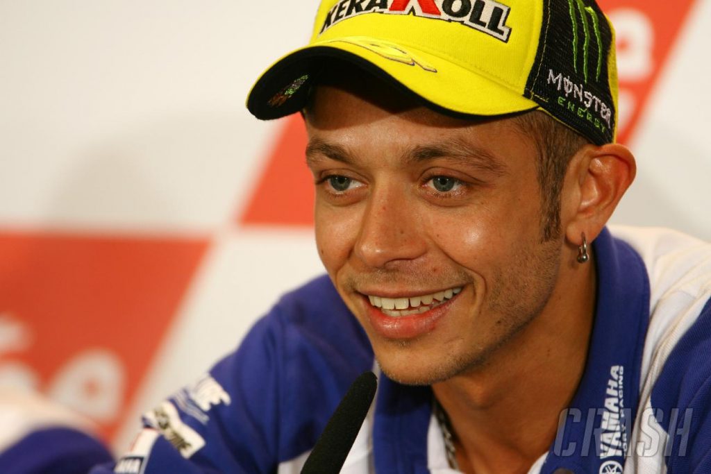 a view of Valentino Rossi, speaking at a press conference. 