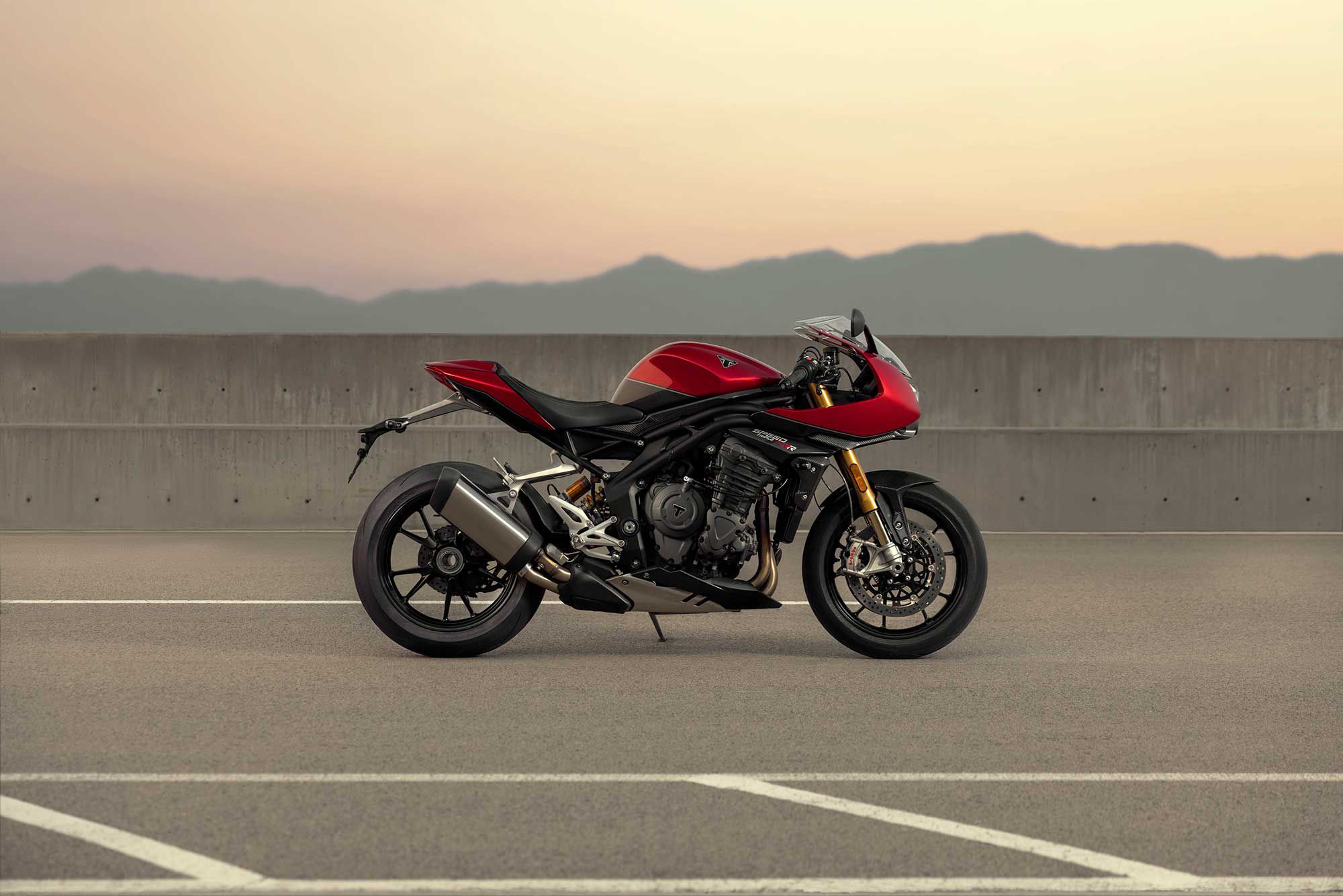 Triumph blends nods to cafe styling with an aggressive, sportbike stance.