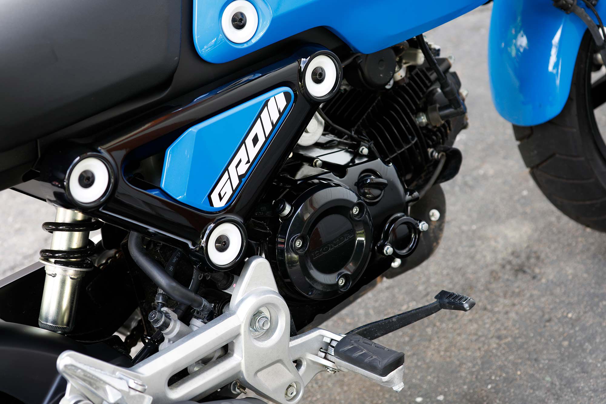 The Grom benefits from a more undersquare air-cooled single with a five-speed transmission. A replaceable oil filter is also integrated into the engine case.