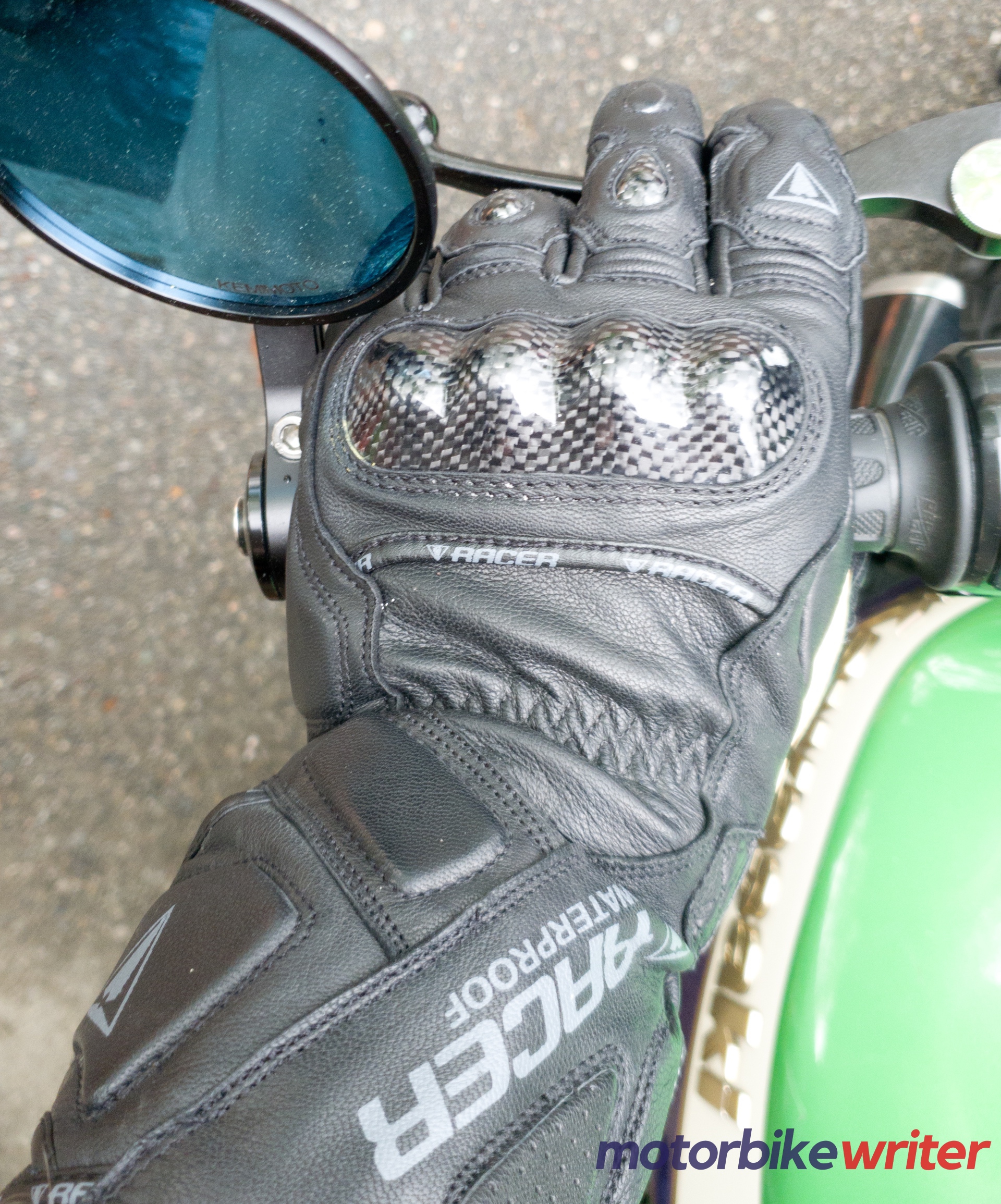 Close-up of left Racer Multitop 2 Waterproof Glove on motorcycle hand grip