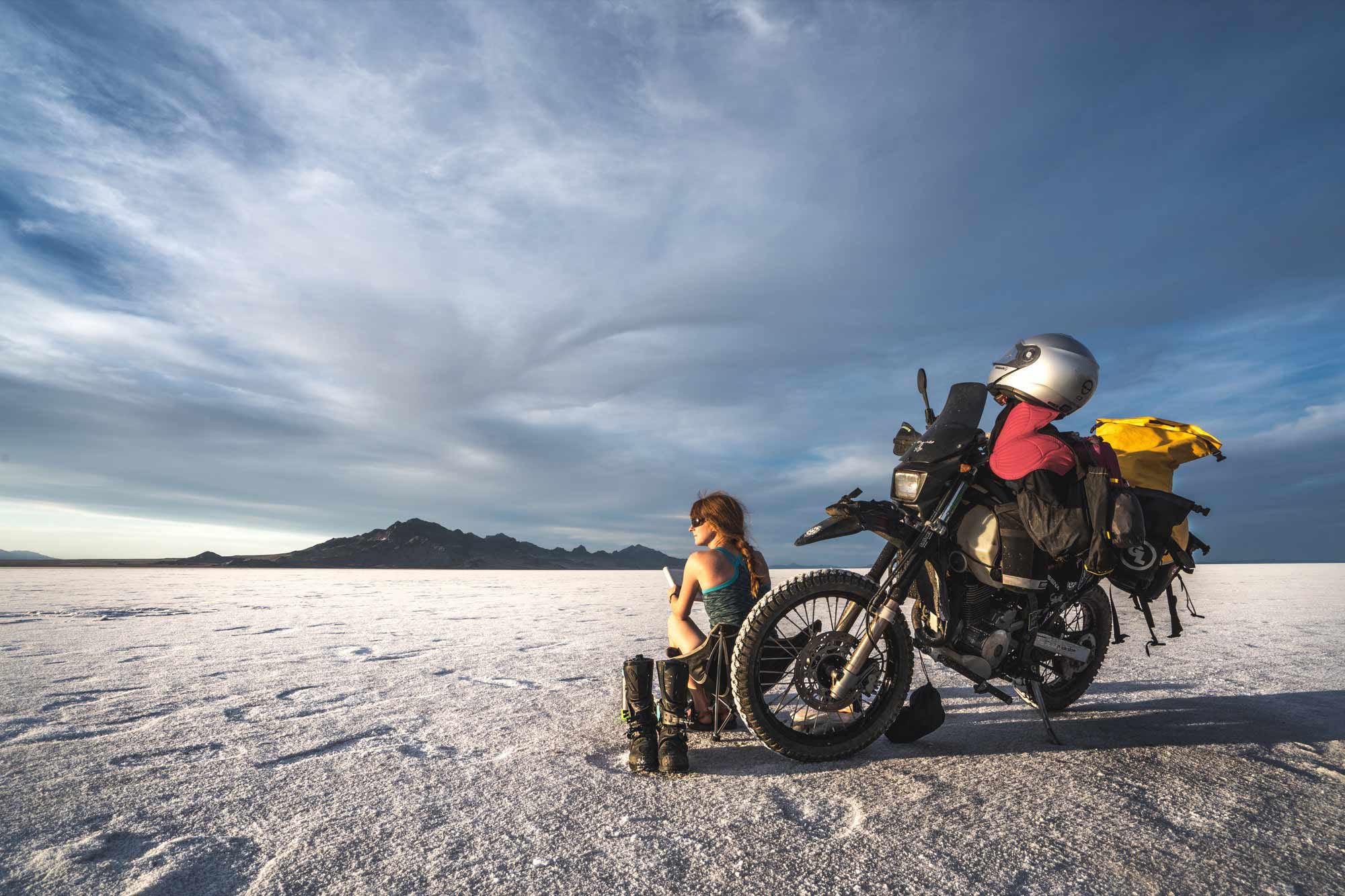 With 80,000 miles clocked on the odometer since docking our container ship into Uruguay, I’d stopped seeing our trip as an extended holiday. Our ride had become a way of life for Jason and me. It enabled us to stop trying to matter; it made us ready to simply live. (Bonneville Salt Flats, Utah)