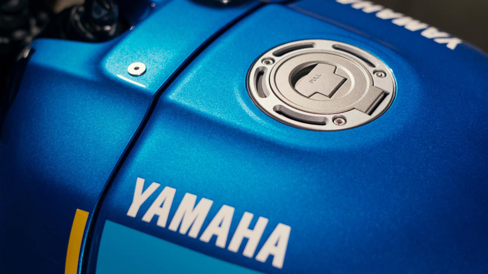 A race-inspired fuel tank is inspired by Yamaha’s ’80s GP machines.
