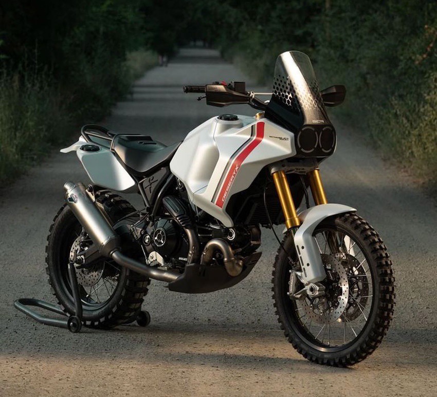 Ducati DesertX concept on dirt road at night