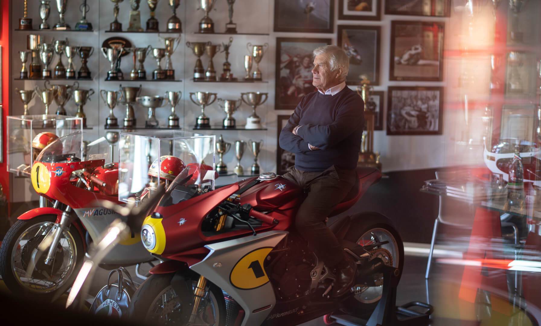 Giacomo Agostini sitting in saddle of 2022 MV Agusta Superveloce Ago