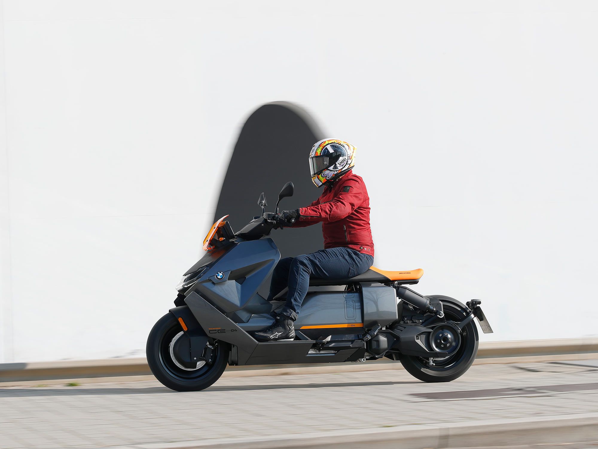 The standard CE 04 comes equipped with underseat storage, enough for a full-face helmet, which is accessible from the side as the seat is fixed in place and very neat, like a large pannier.