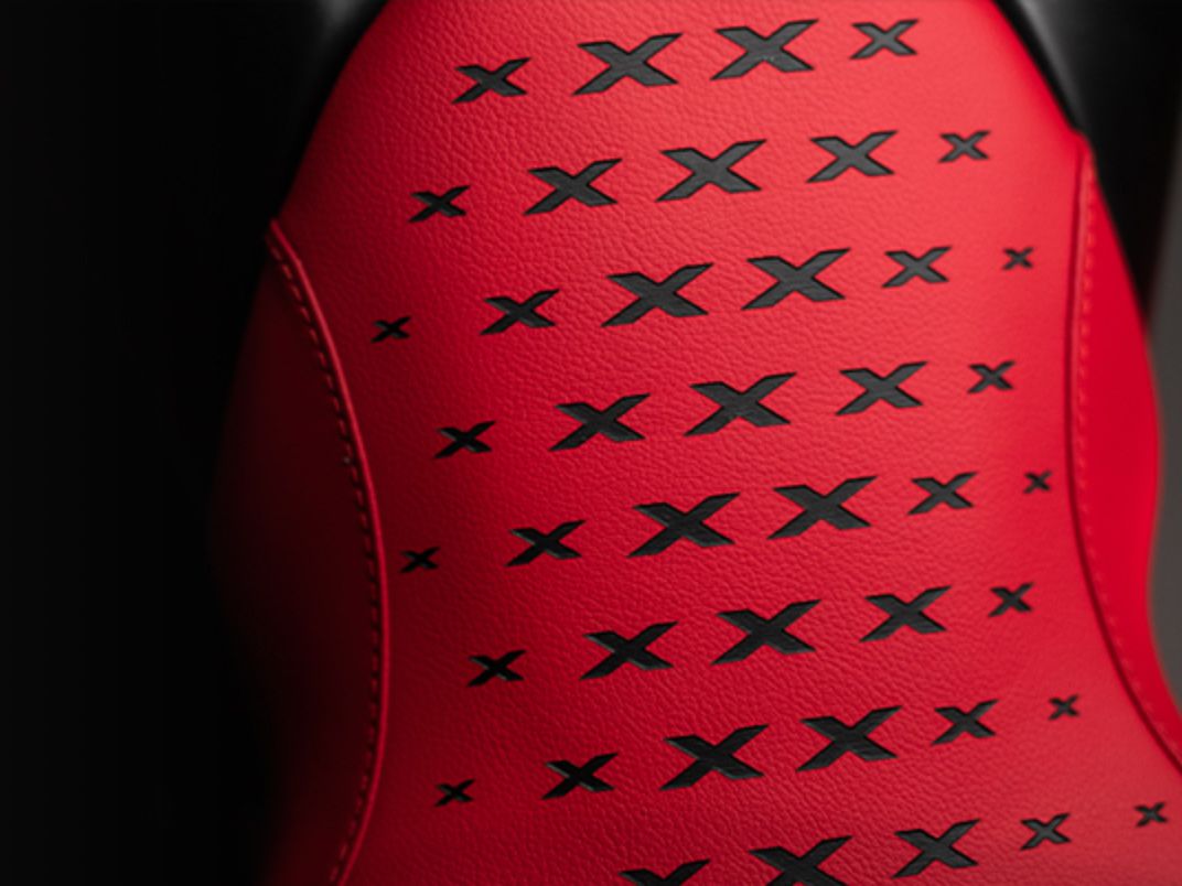 The “X” motif is laser-engraved in each seat regardless of color choice.