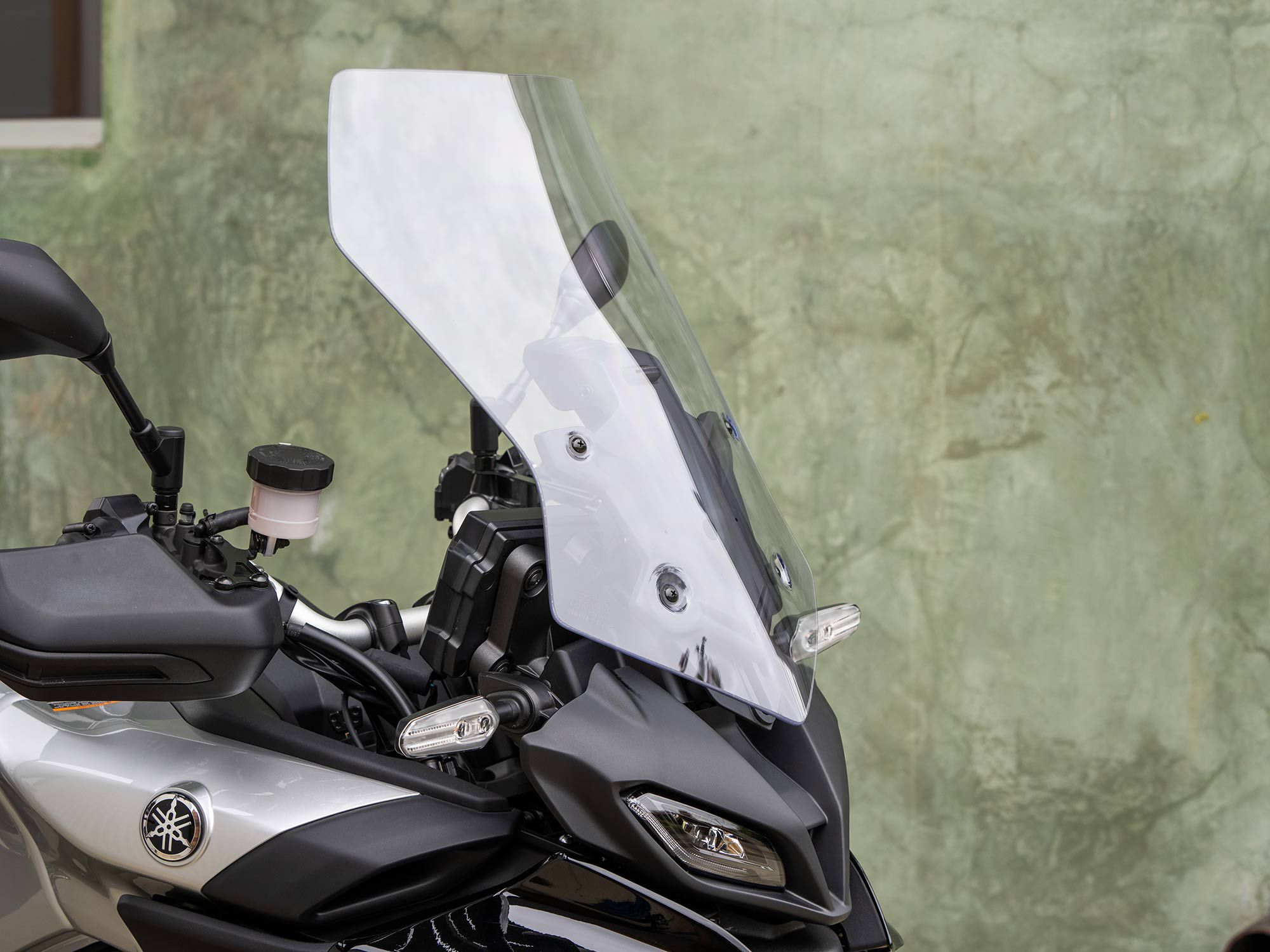 A tall, manually adjustable windscreen does a fine job of shielding the rider from the elements.