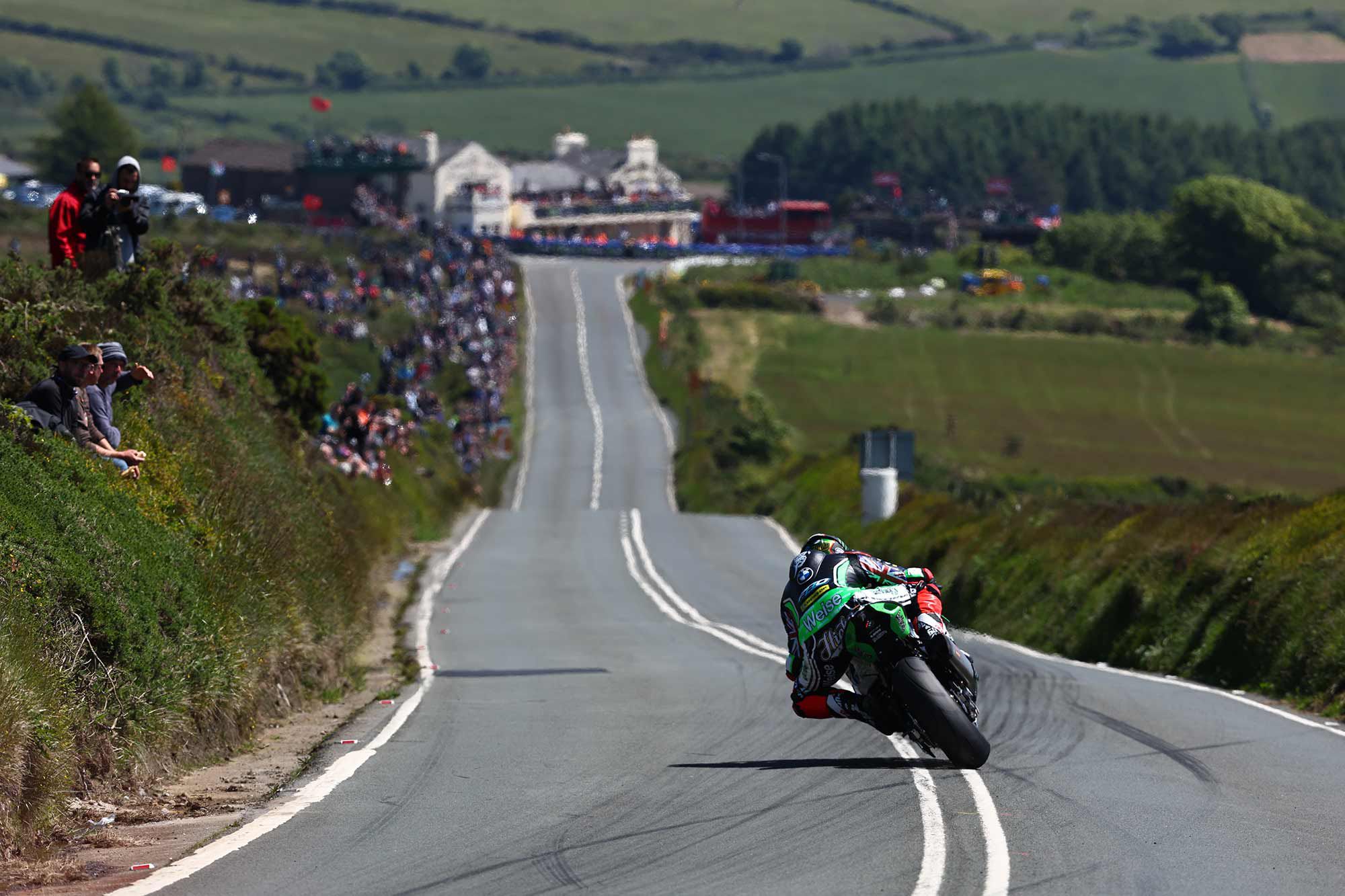 Peter Hickman makes a charge towards Creg-ny-Baa, around the 34th mile of the course.