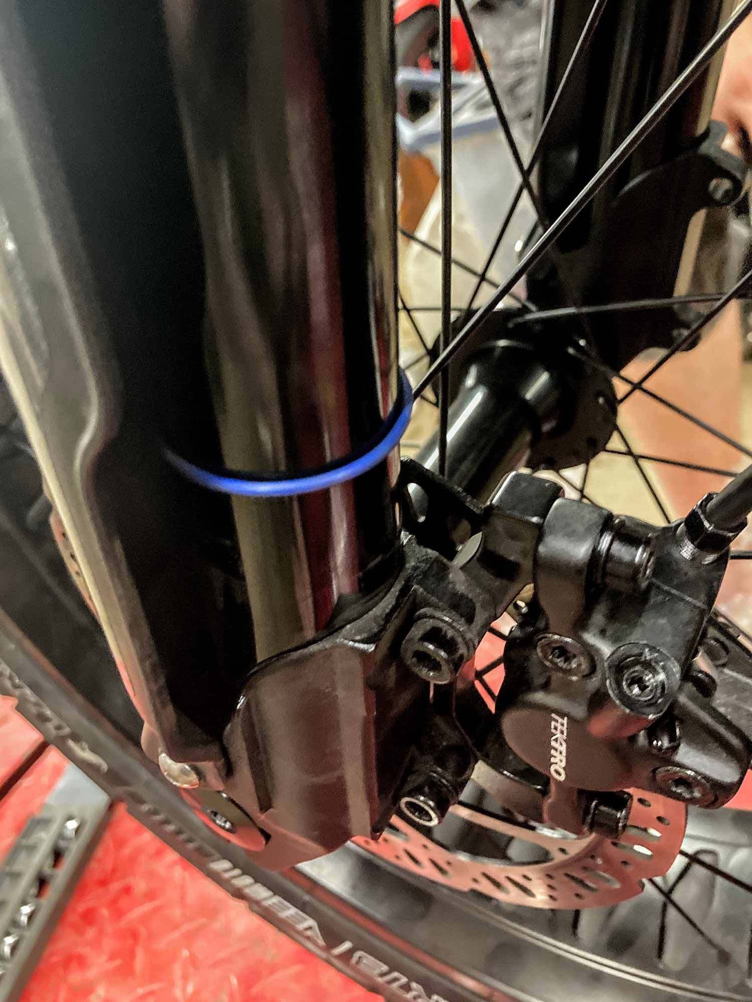 Mystery blue O-ring on left fork stanchion.
