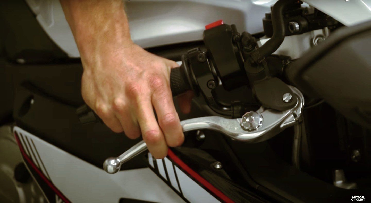 Using the front and rear brake to initiate the stop, while finishing with only the rear brake gives us the most balanced and safe stopping motion.