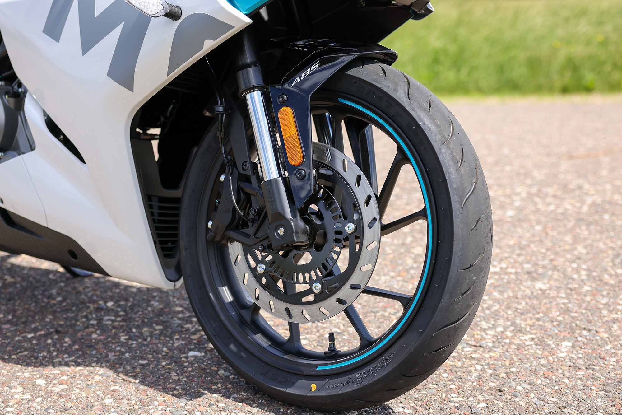 Front brake package consists of a 300mm disc and four-piston caliper. Notice the design touches on the wheel.
