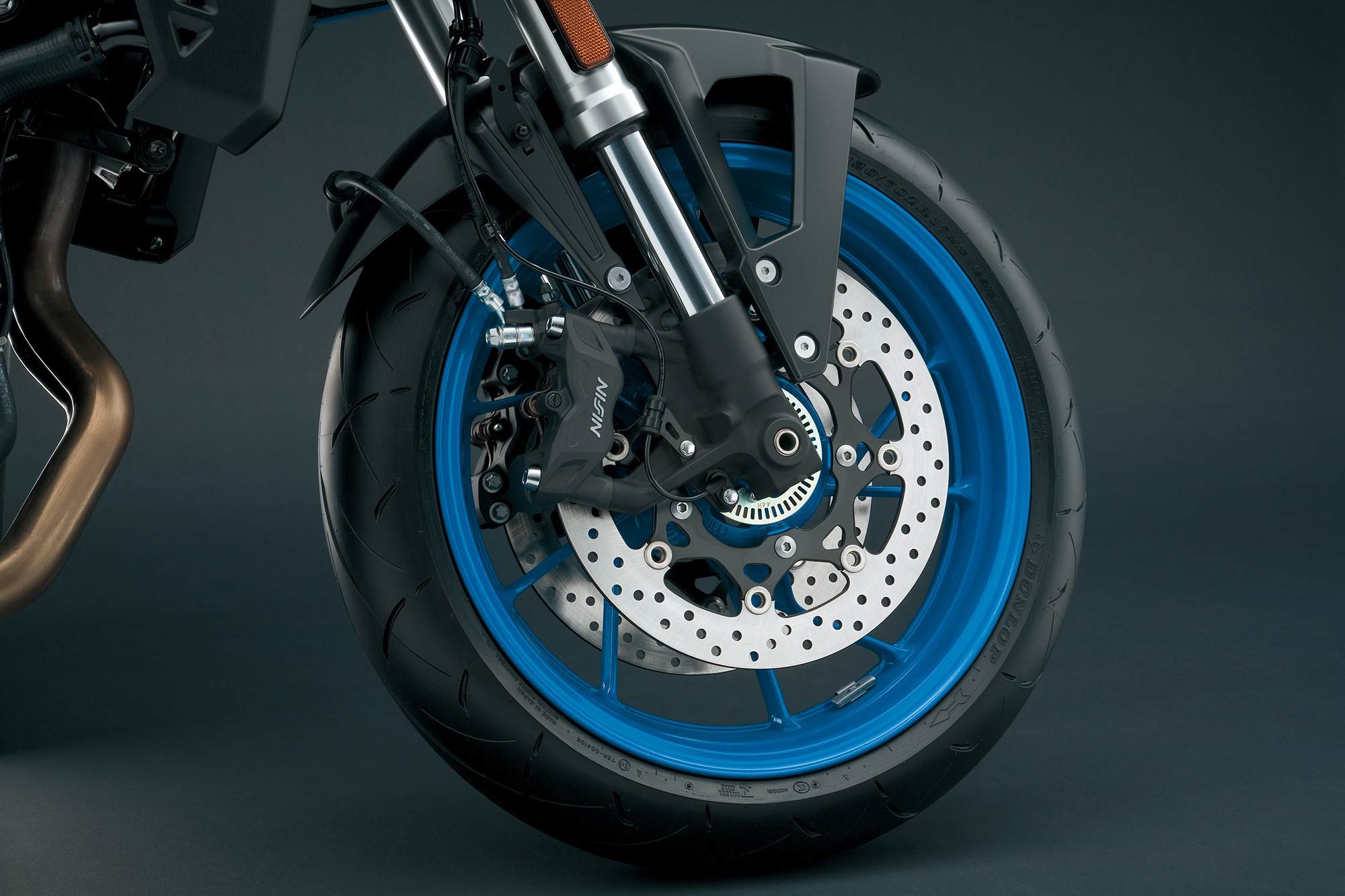 Nissin brakes are used front and rear, with four-piston front caliper biting on 310mm discs.