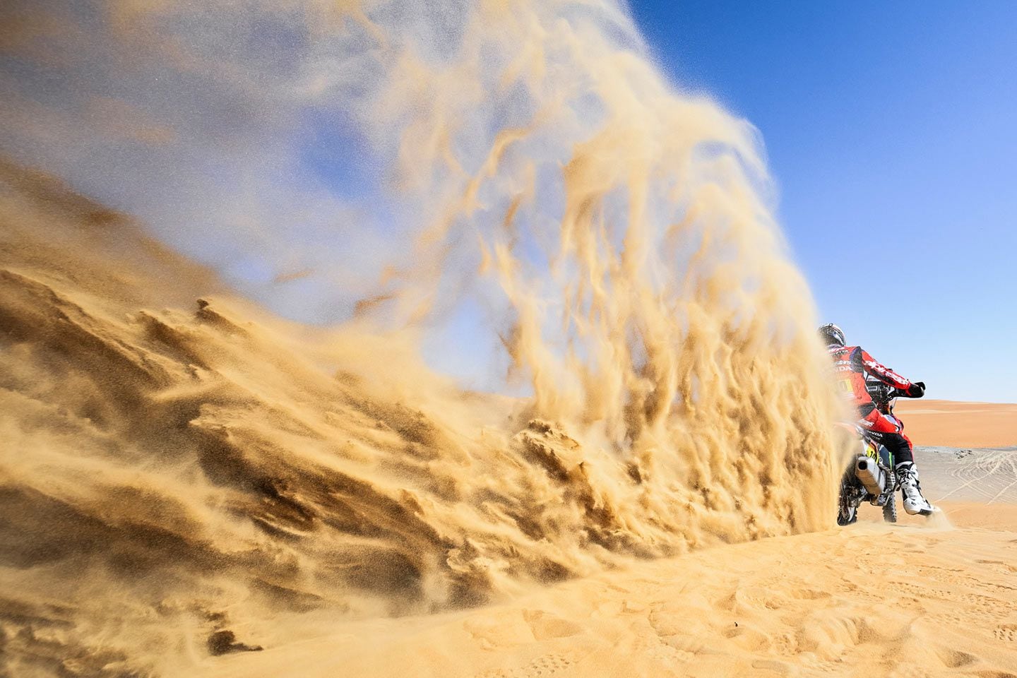 Creating rooster tails of sand is Skyler “Mustache Man” Howes on the Monster Energy Honda Team Honda during Stage 5.