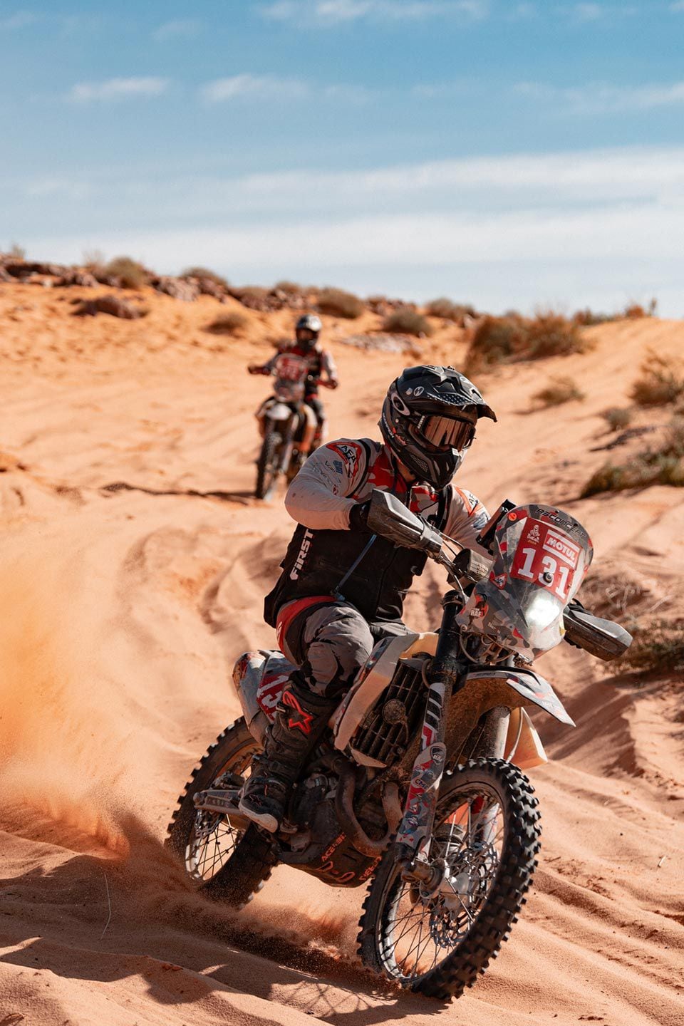 Anthony Fabre, of Team ARF, guides his KTM through the powdered sand of Stage 9.