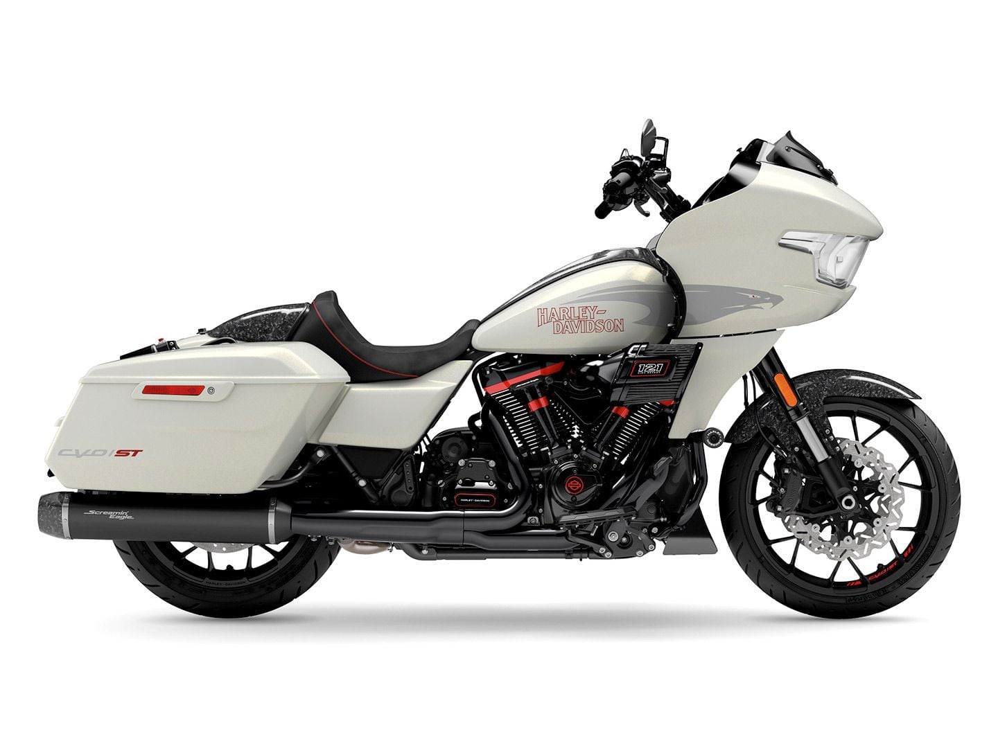 The 2024 CVO Road Glide ST flaunts its aggressive West Coast style with a deep solo seat and 6-inch riser paired with a moto handlebar that plants the rider in an attack position. The bike is available in two premium finishes; this one is called Golden White Pearl.